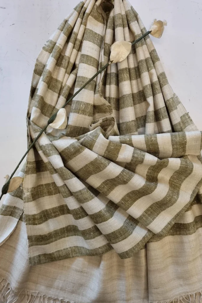 Handwoven striped Ahimsa Eri silk stole naturally dyed with onion skin in soft olive and ivory tones with delicate fringes.