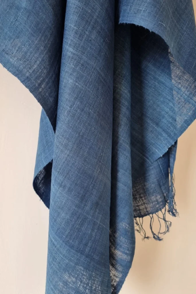 Handwoven Ahimsa Eri silk stole naturally dyed with indigo, featuring deep earthy blue tones and soft artisanal texture.