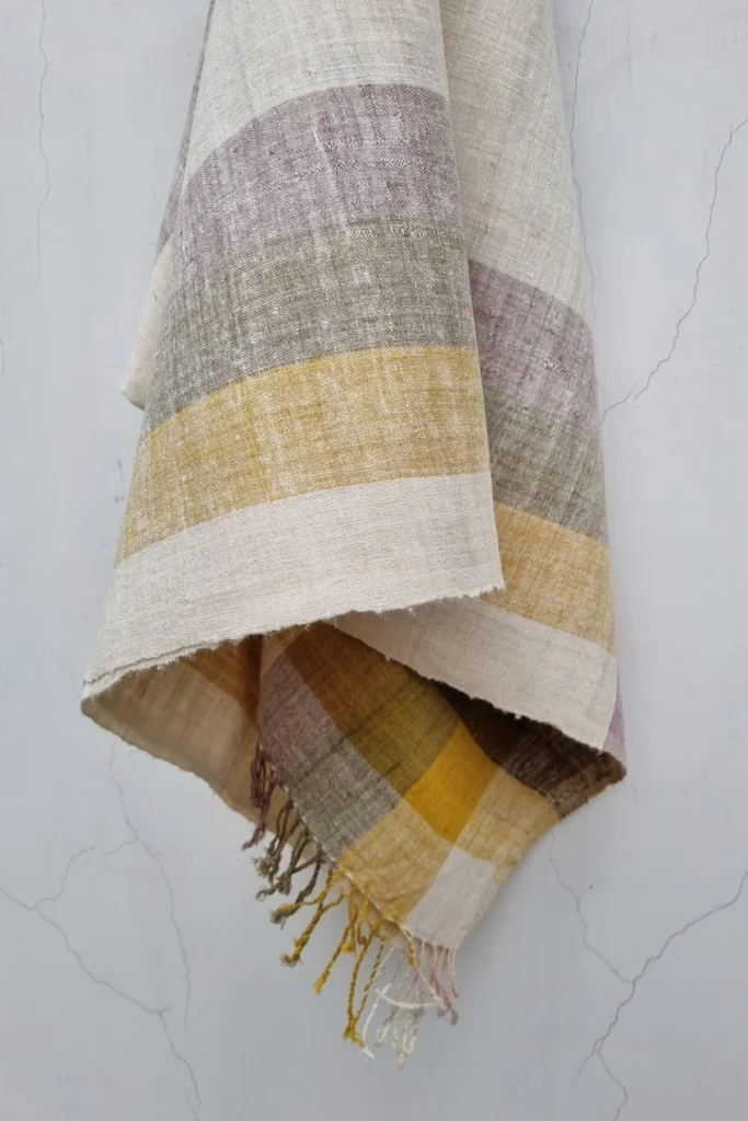 Handwoven Ahimsa Eri silk stole featuring soft multicolor stripes dyed with turmeric, onion skin, and Indian madder.